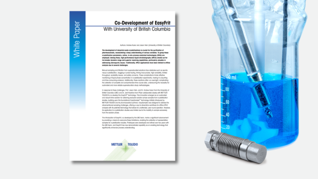 White paper with glass reactor with sampling probe and blue liquid