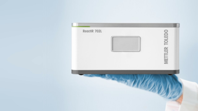 reactir held by the gloved hand of a scientist reactir held by the gloved hand of a scientist