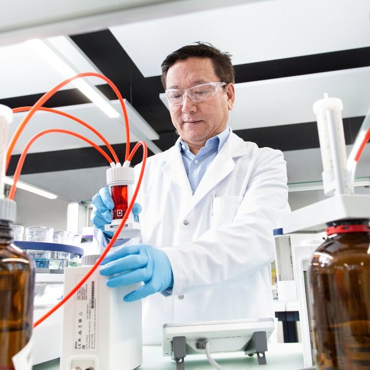 Scientist working with lab equipment and samples