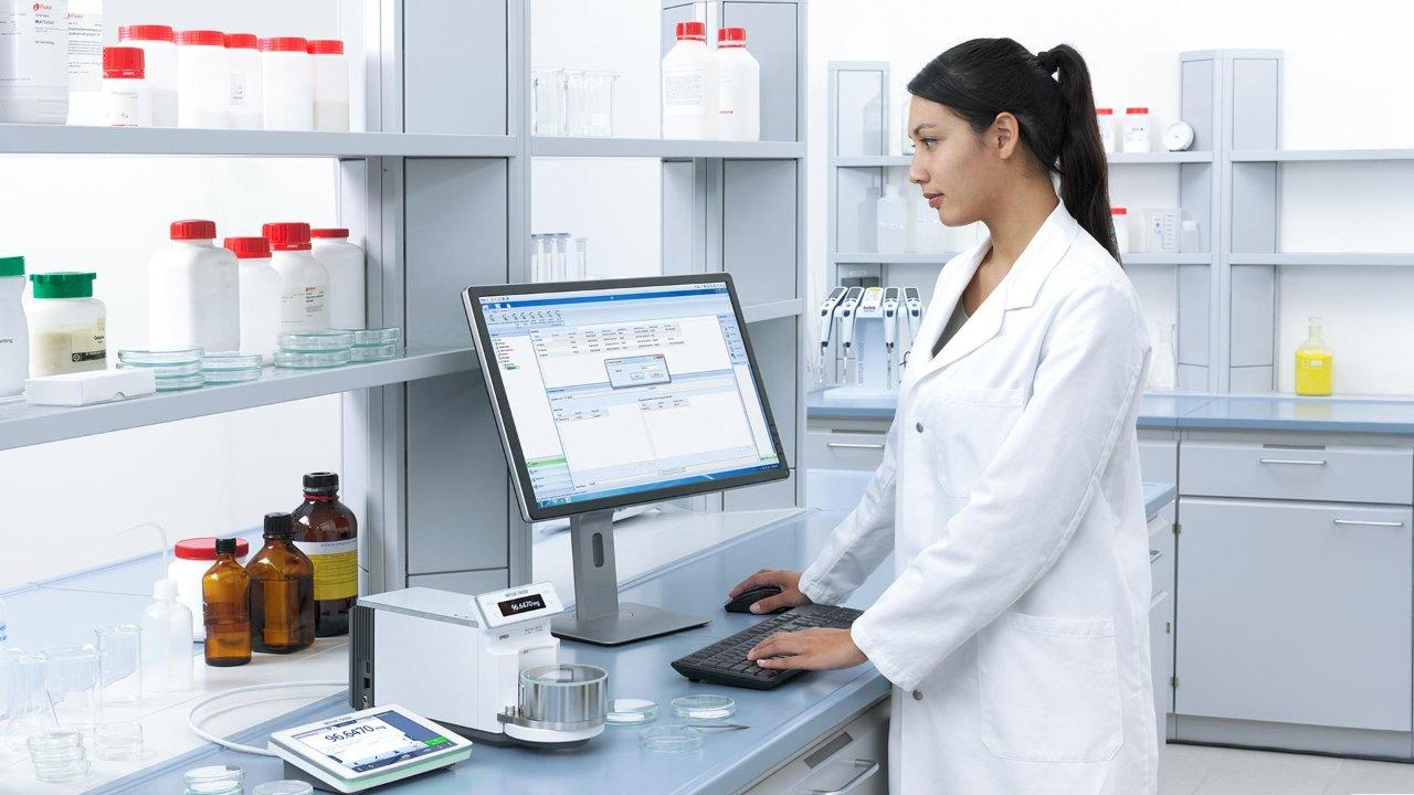 Female scientist working on a computer in a lab