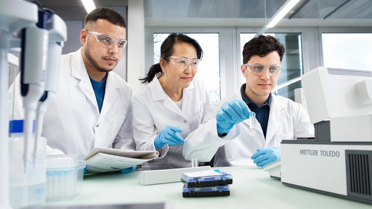 Scientists training on how to use lab instruments