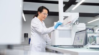 Scientist working on thermal analysis equipment