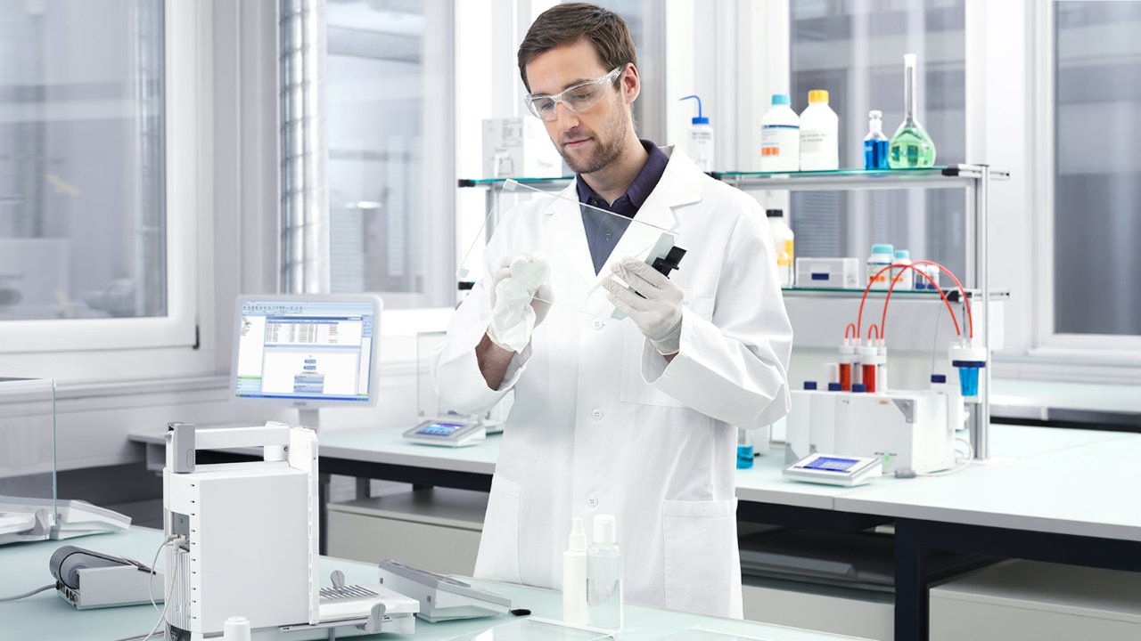 Scientist cleaning laboratory instruments