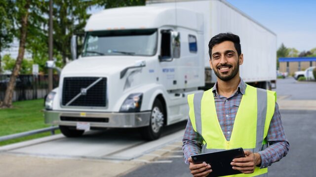 a person in front of a truck a person in front of a truck