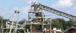 Precise weighing of flowing material