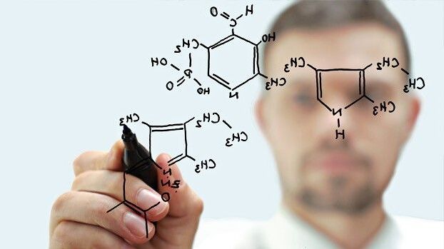Man drawing molecule with a marker